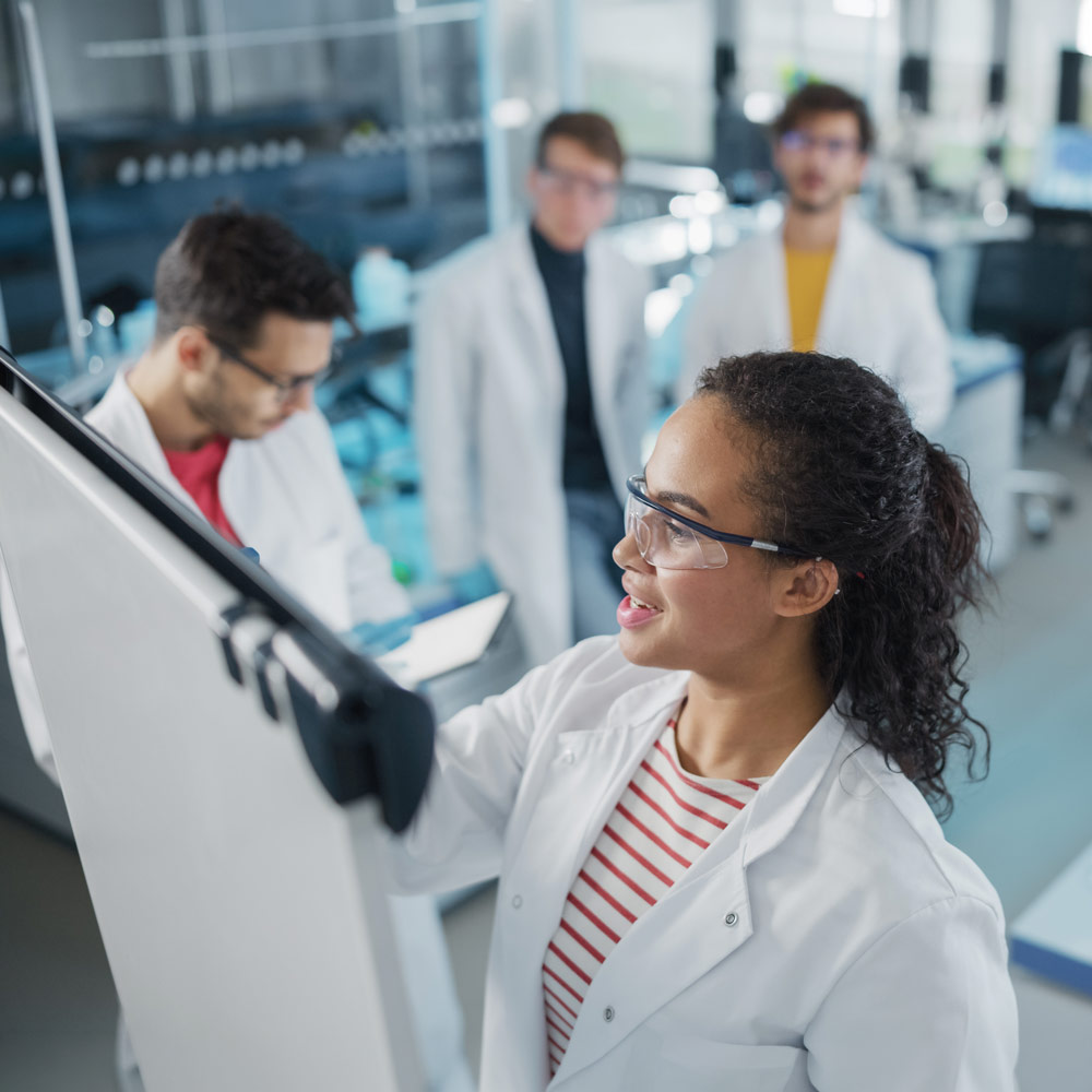 CSV CSA Project manager at white board leading small team of engineers